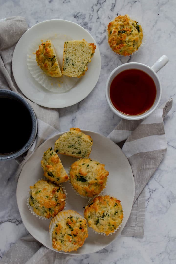 Spinach and cheese muffins from above with a cup of rooibos tea
