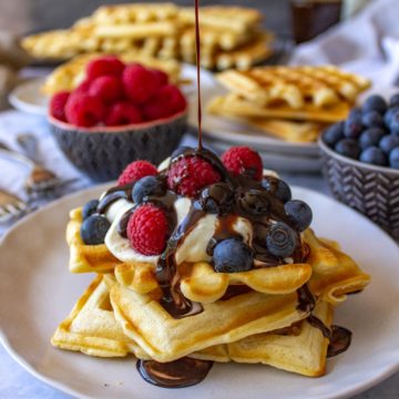 Super easy waffles with cream, berries and chocolate sauce