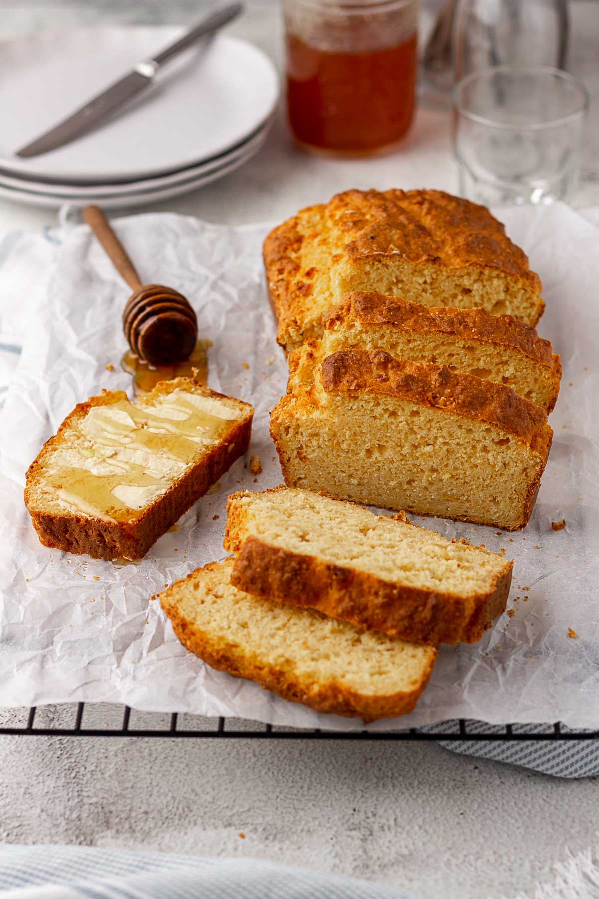 Sliced mealie bread with butter and honey.