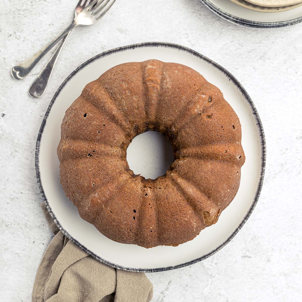 cooled orange gingerbread cake on a plate