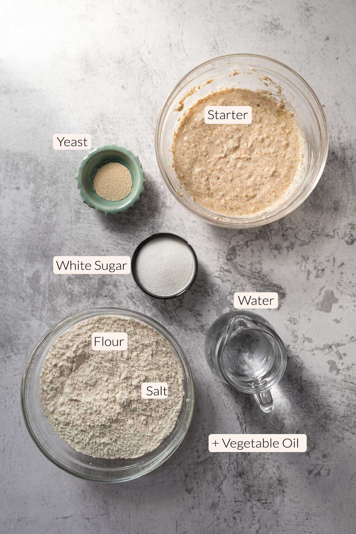 Country bread ingredients - flour, starter, salt, yeast, sugar, water, vegetable oil.
