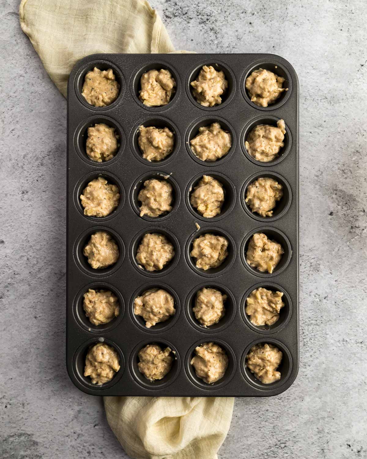 cheese muffin layer divided into mini muffin pan