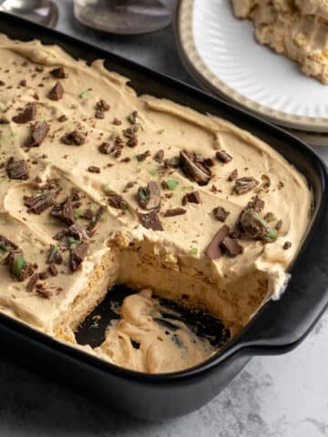 Peppermint crisp tart in a dish with a portion served on a plate.