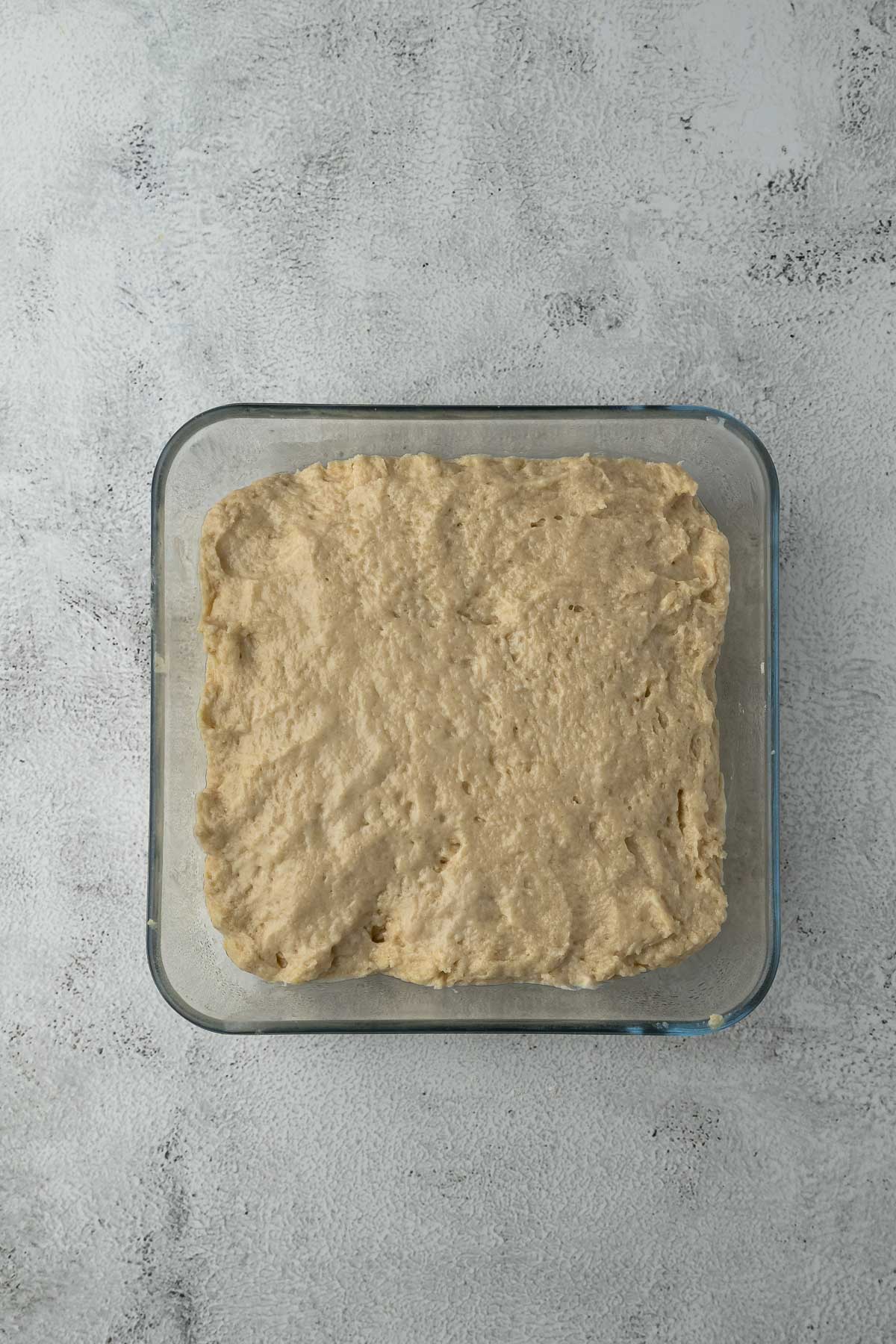 Rusk dough in a baking dish to make sliced rusks