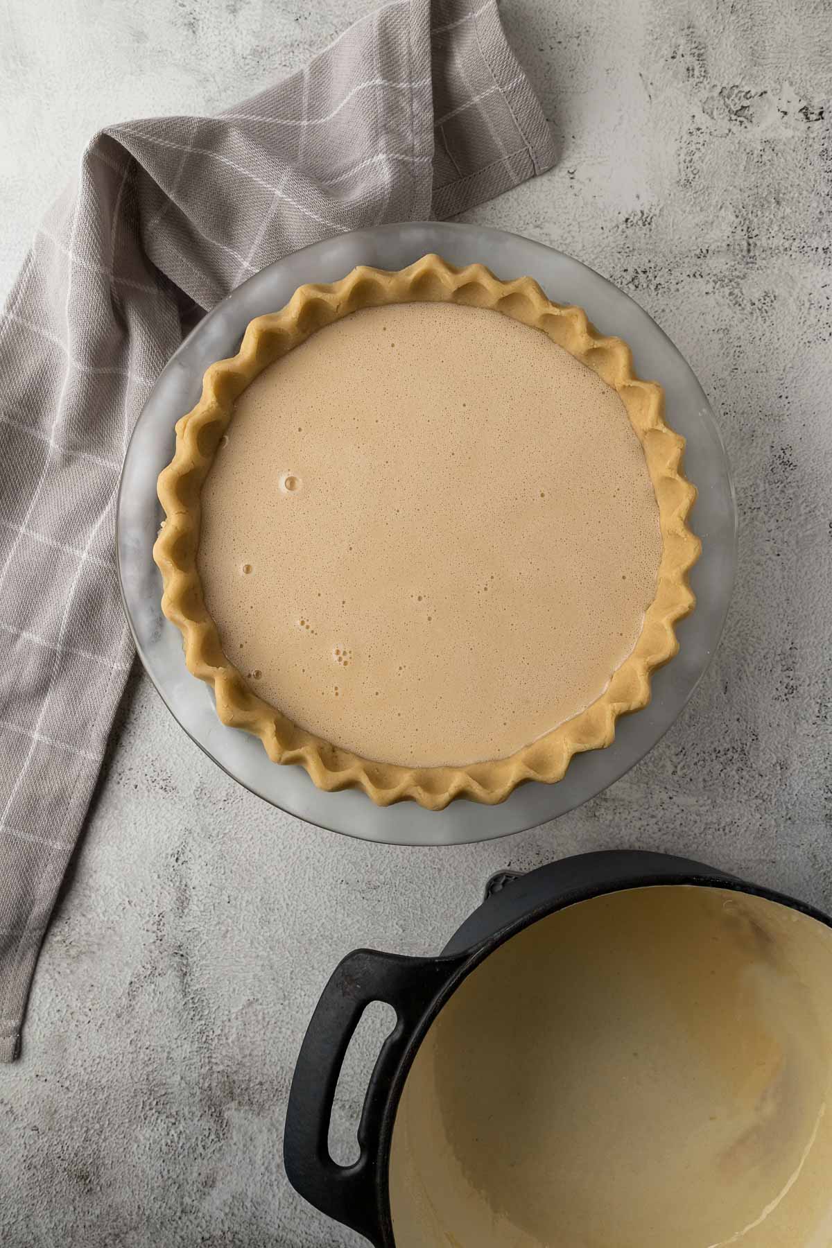 milk tart filling poured into the crust