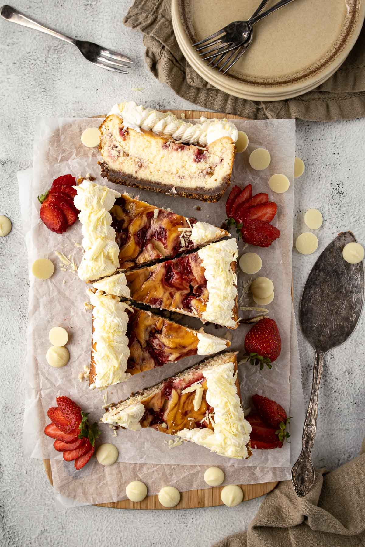 Sliced small-batch strawberry white chocolate cheesecake viewed from above