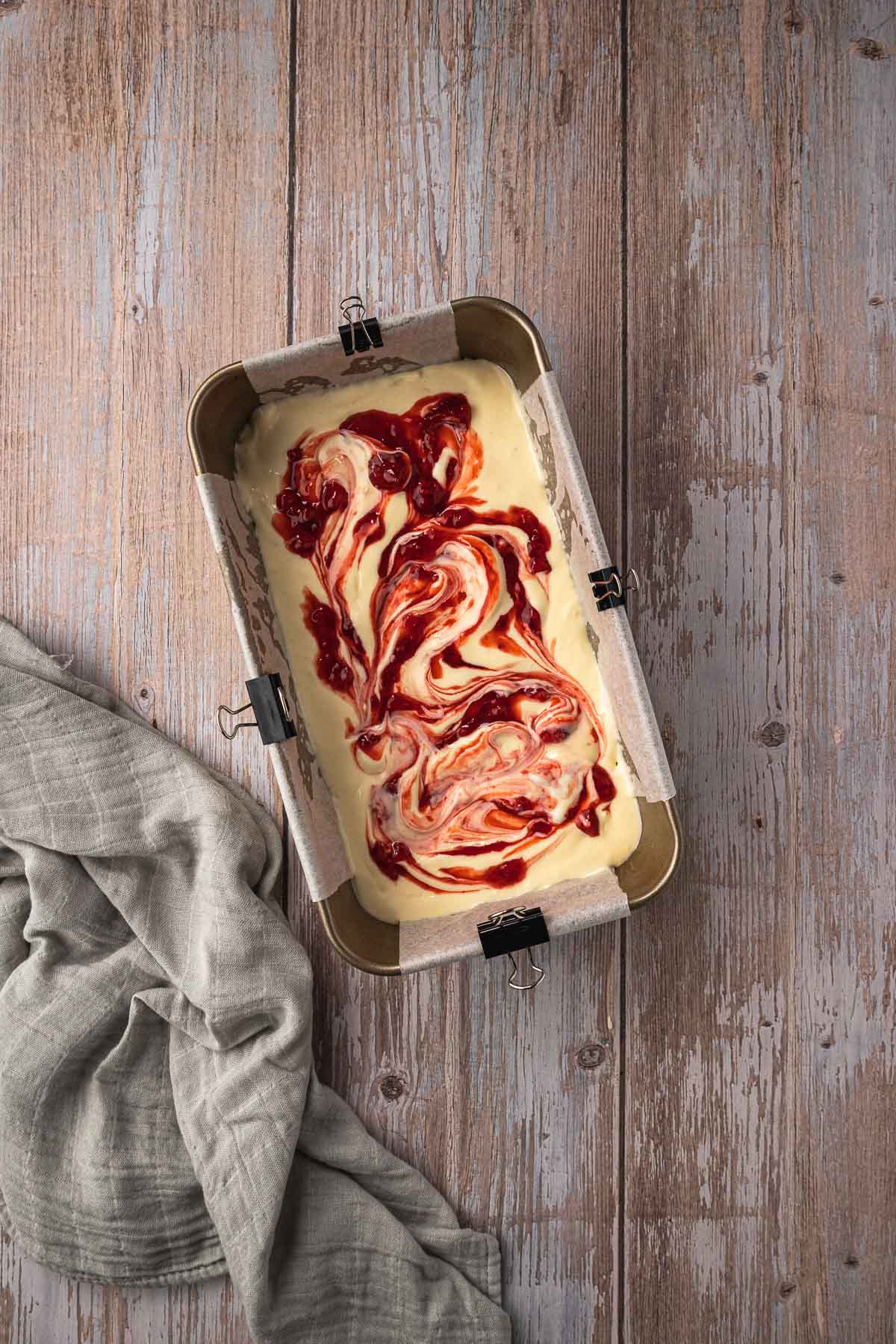 Strawberry compote swirled into the cheesecake filling