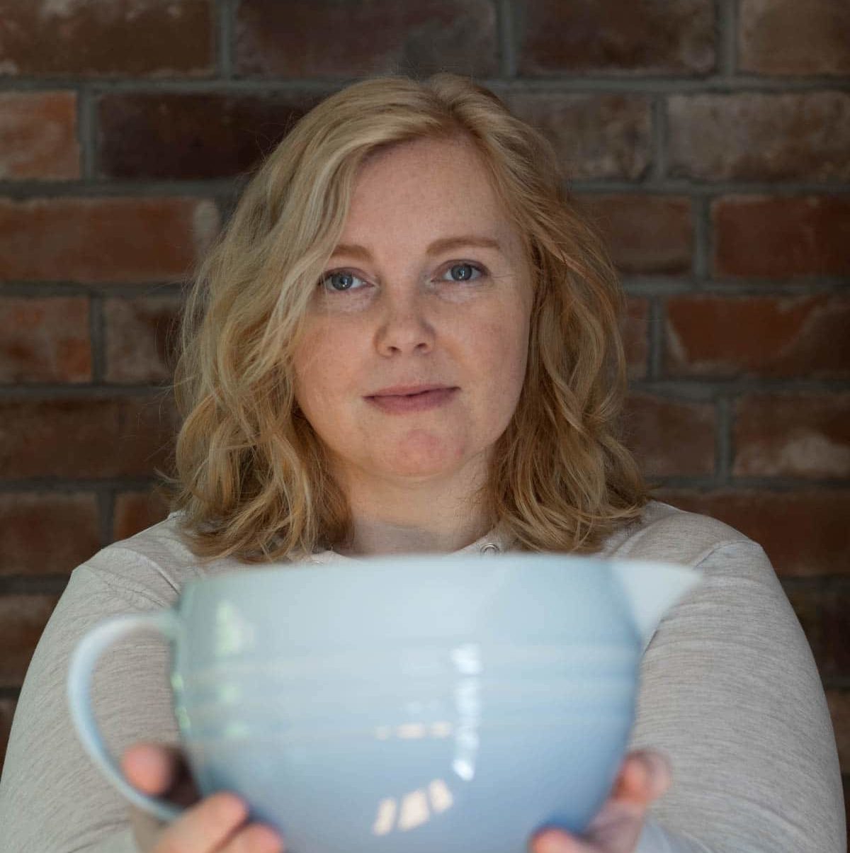 Woman holding a large mixing bowl