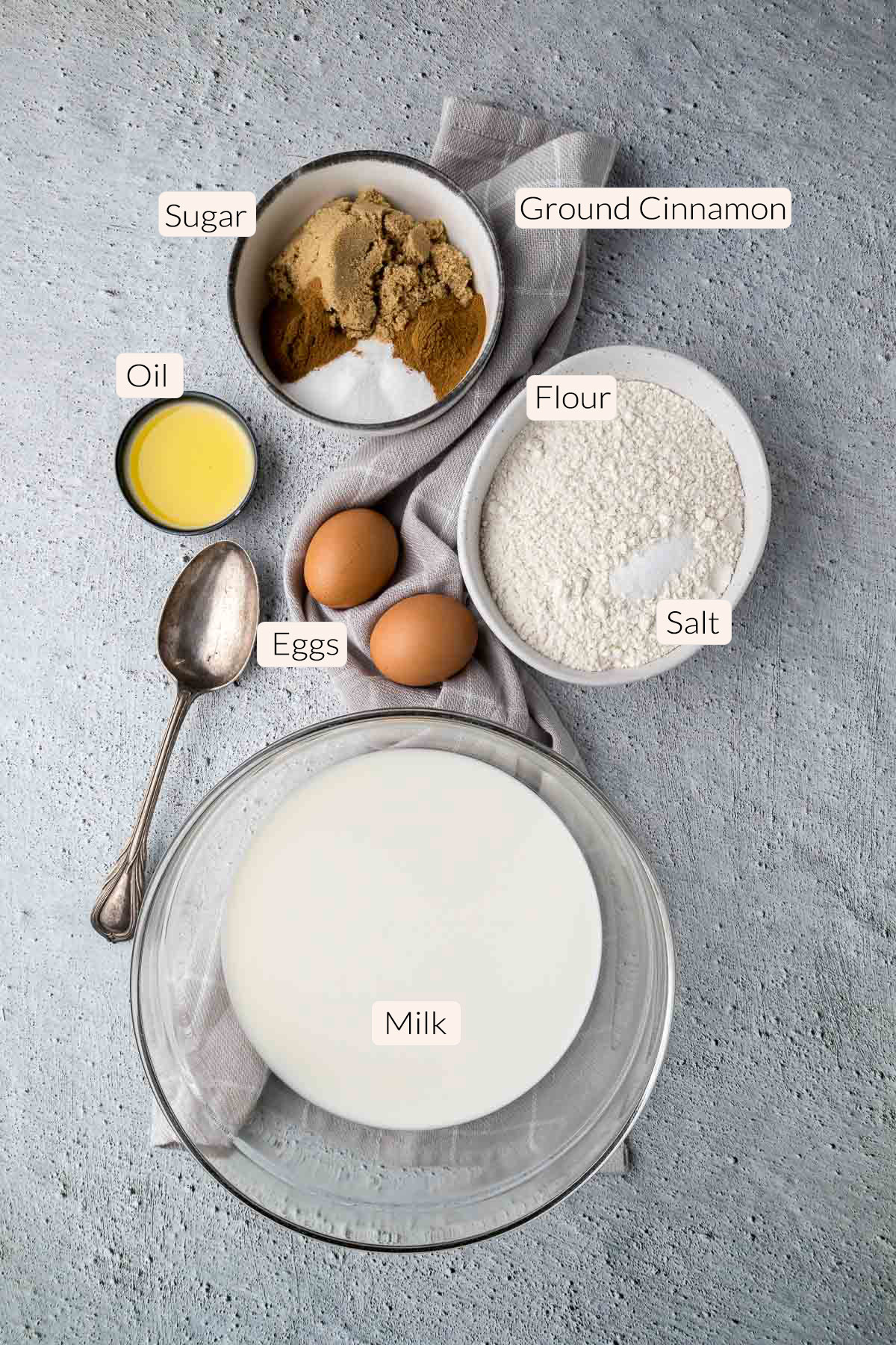 Pannekoek ingredients - flour, salt, sugar, cinnamon, eggs, oil and milk.