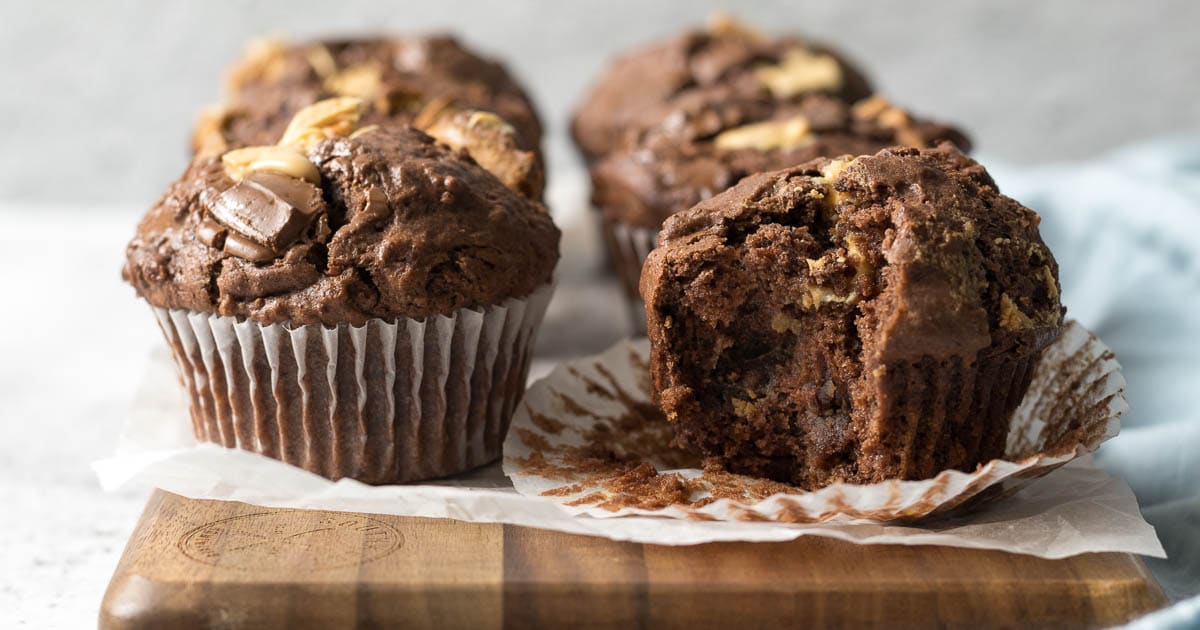 Triple chocolate muffins on a platter.