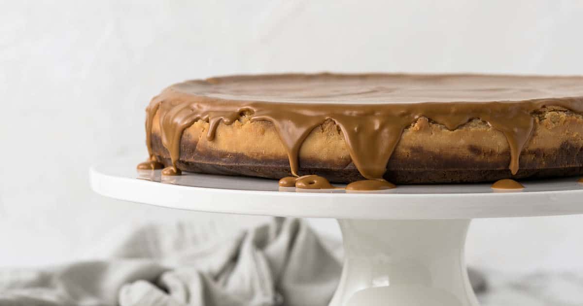 Lotus Biscoff Cheesecake on a cake stand.