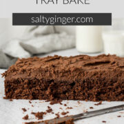 Sliced chocolate tray bake showing milk chocolate ganache.