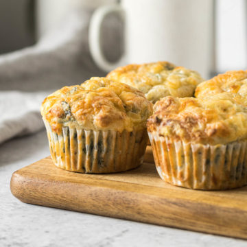 Feta and spinach muffins on a platter.
