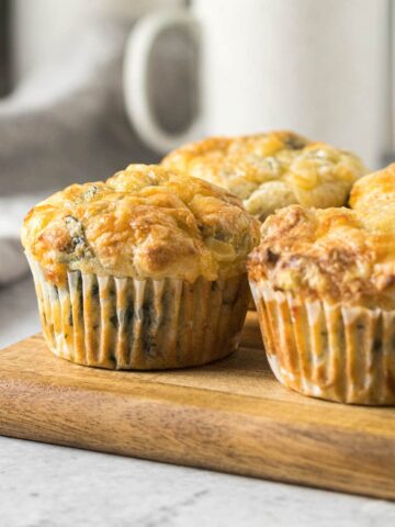 Feta and spinach muffins on a platter.