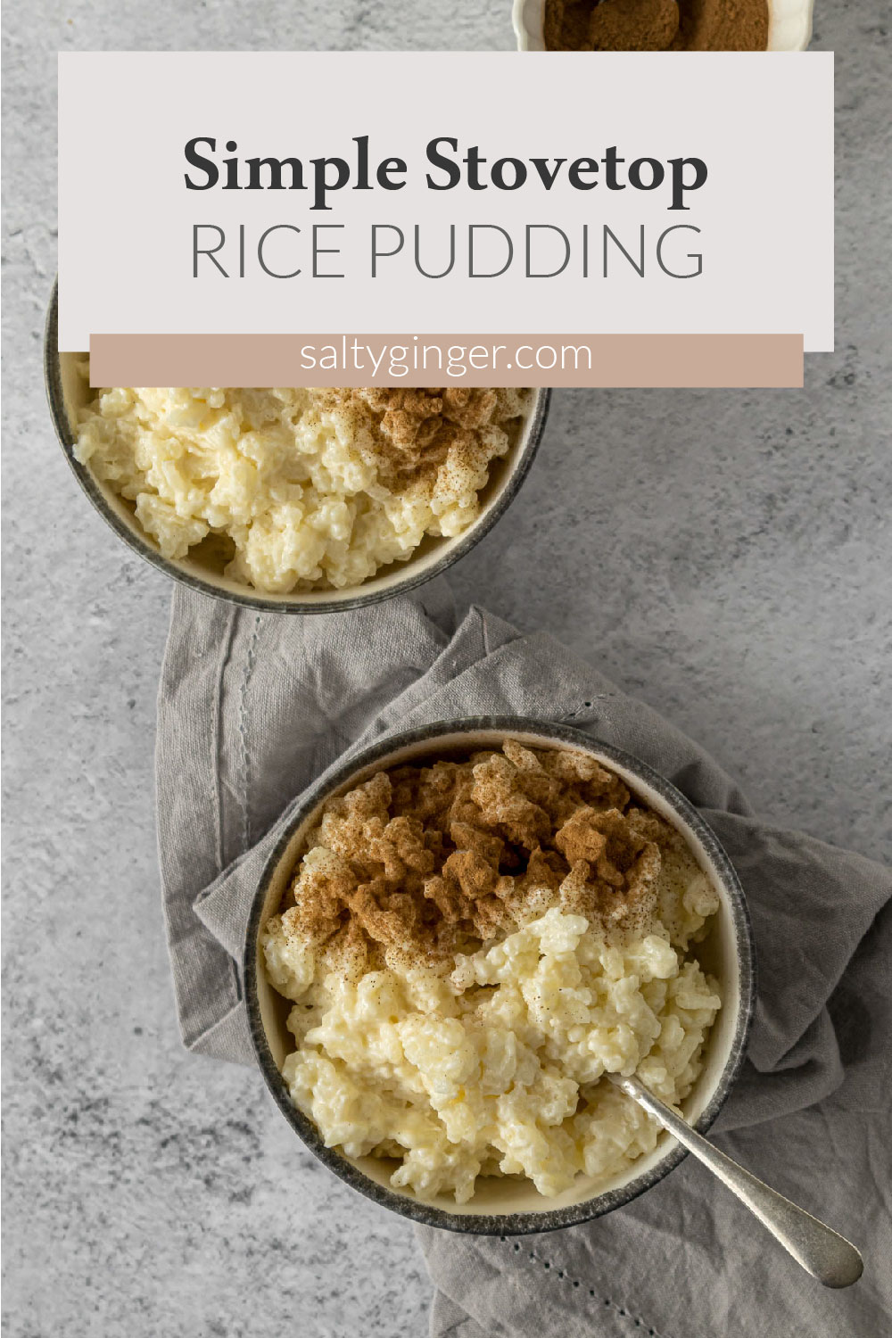 Vanilla rice pudding in bowls topped with ground cinnamon.