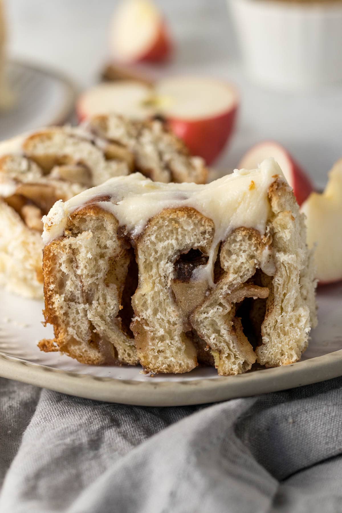 Cinnamon roll with apple pie filling sliced in half.