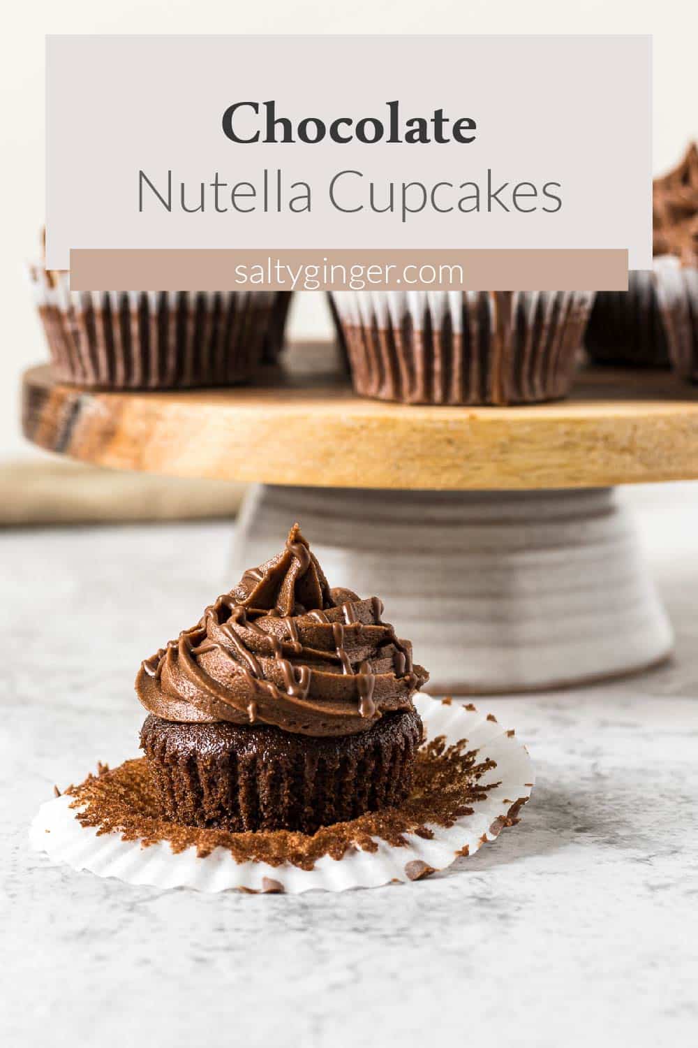Frosted nutella cupcake with a Nutella drizzle.