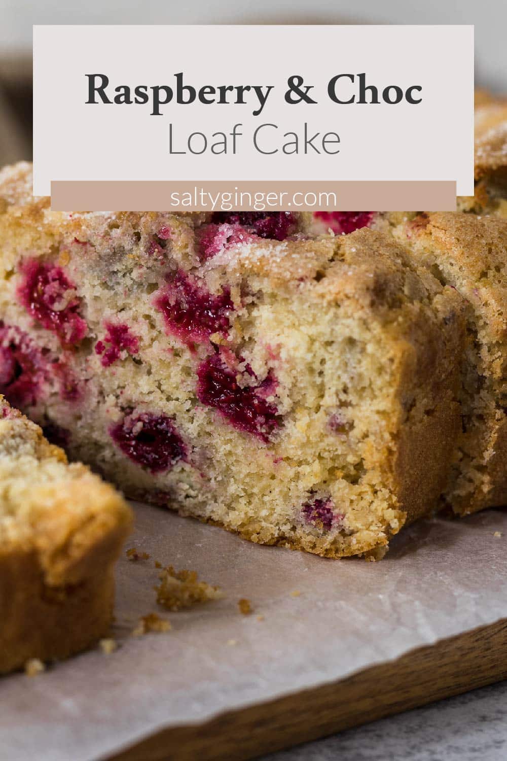 Slice of raspberry and white chocolate loaf cake.