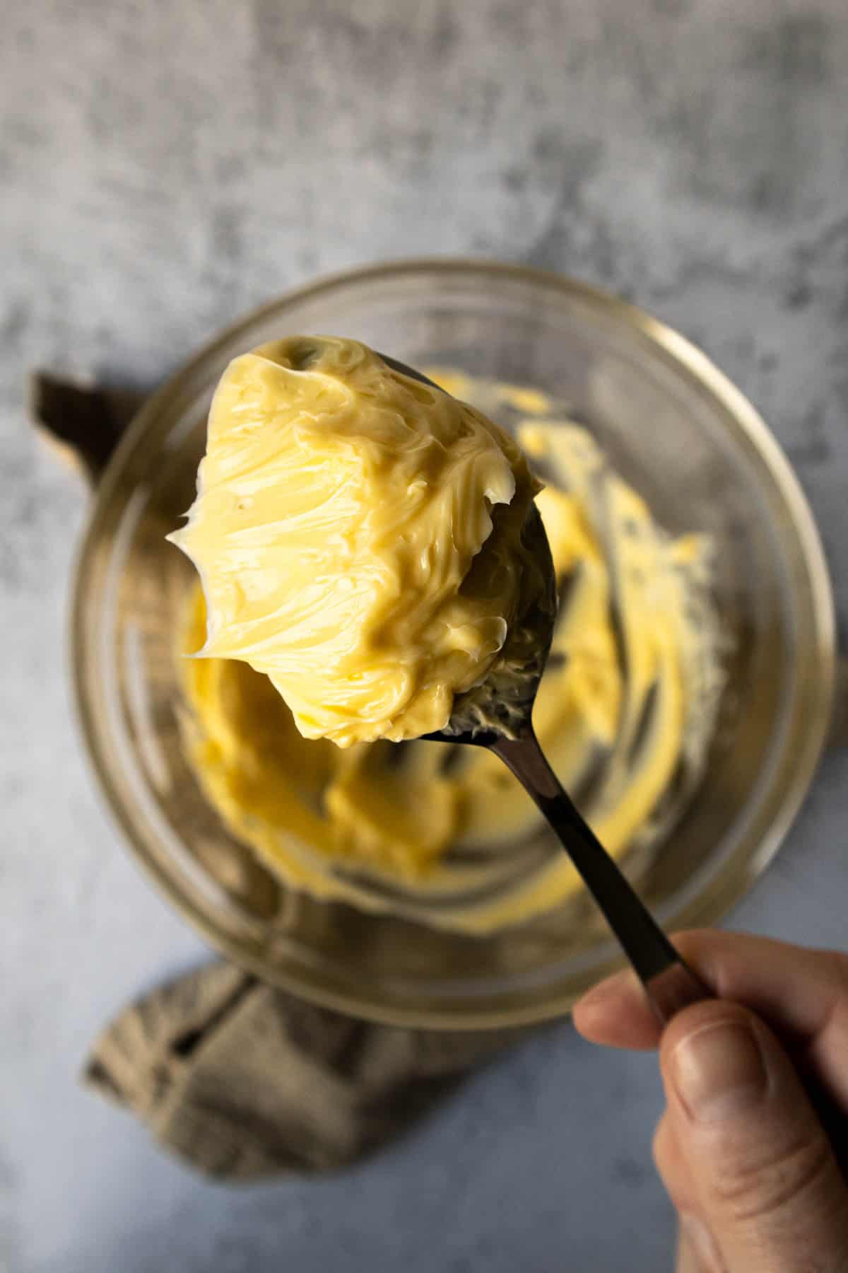 Partially creamed butter on back of spoon.