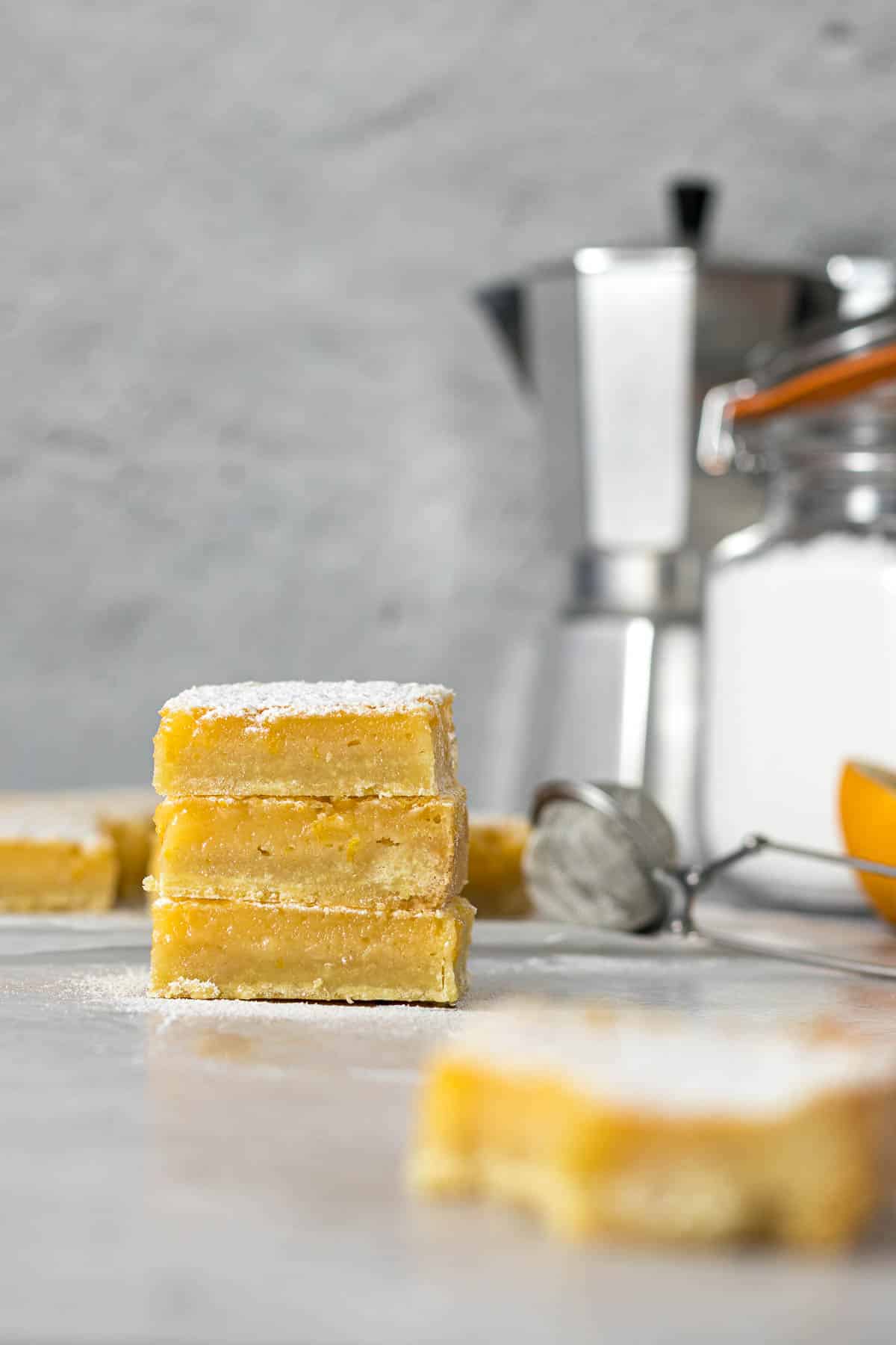 Stack of lemon slices dusted with icing sugar.