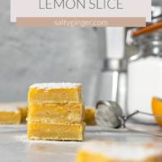 Stacked lemon bars dusted with icing sugar.