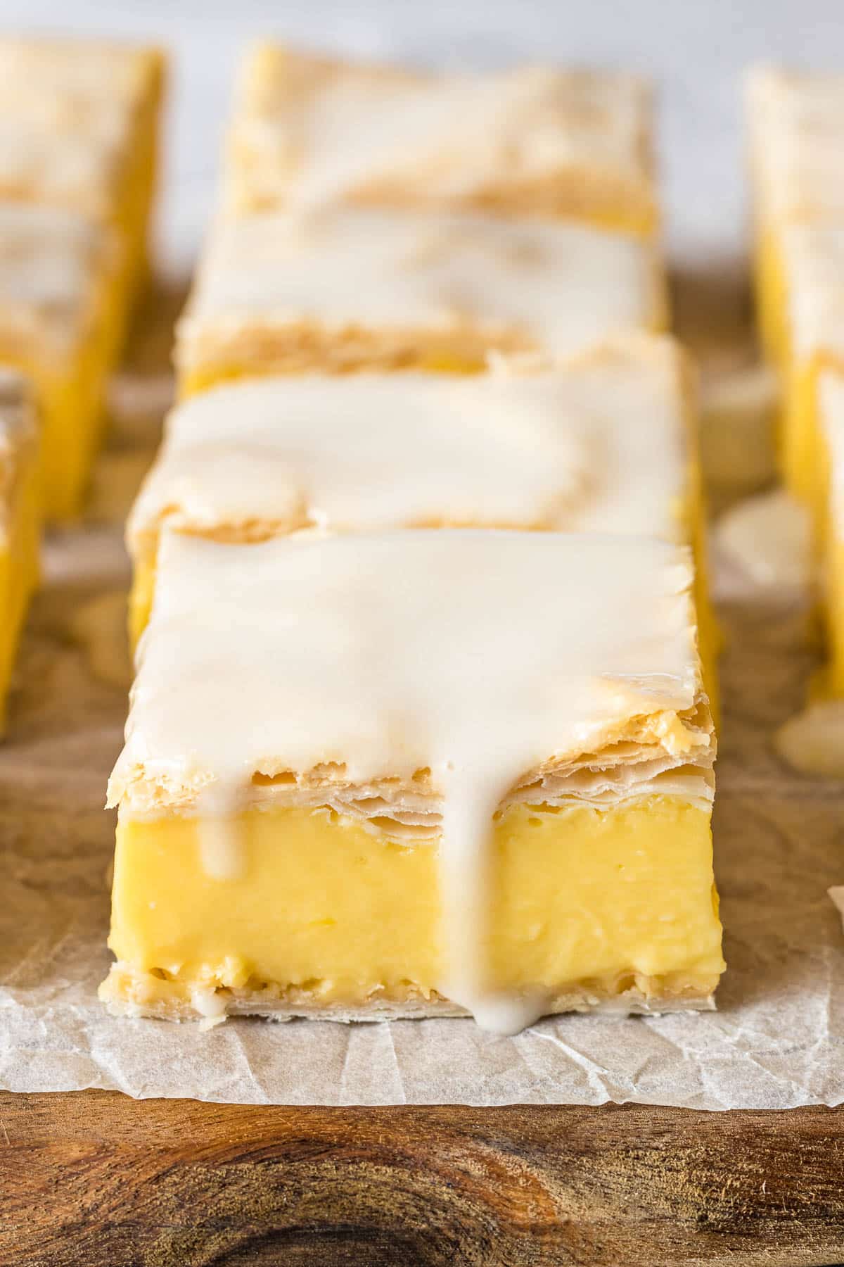 Vanilla custard slice topped with an icing glaze.
