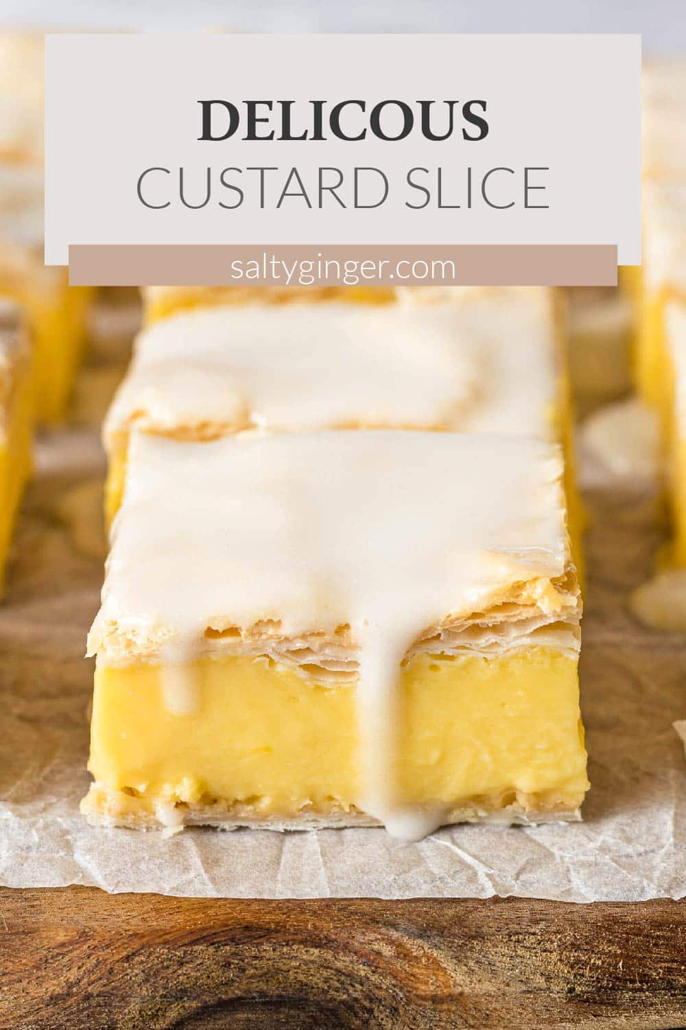 Vanilla custard slice topped with an icing glaze.