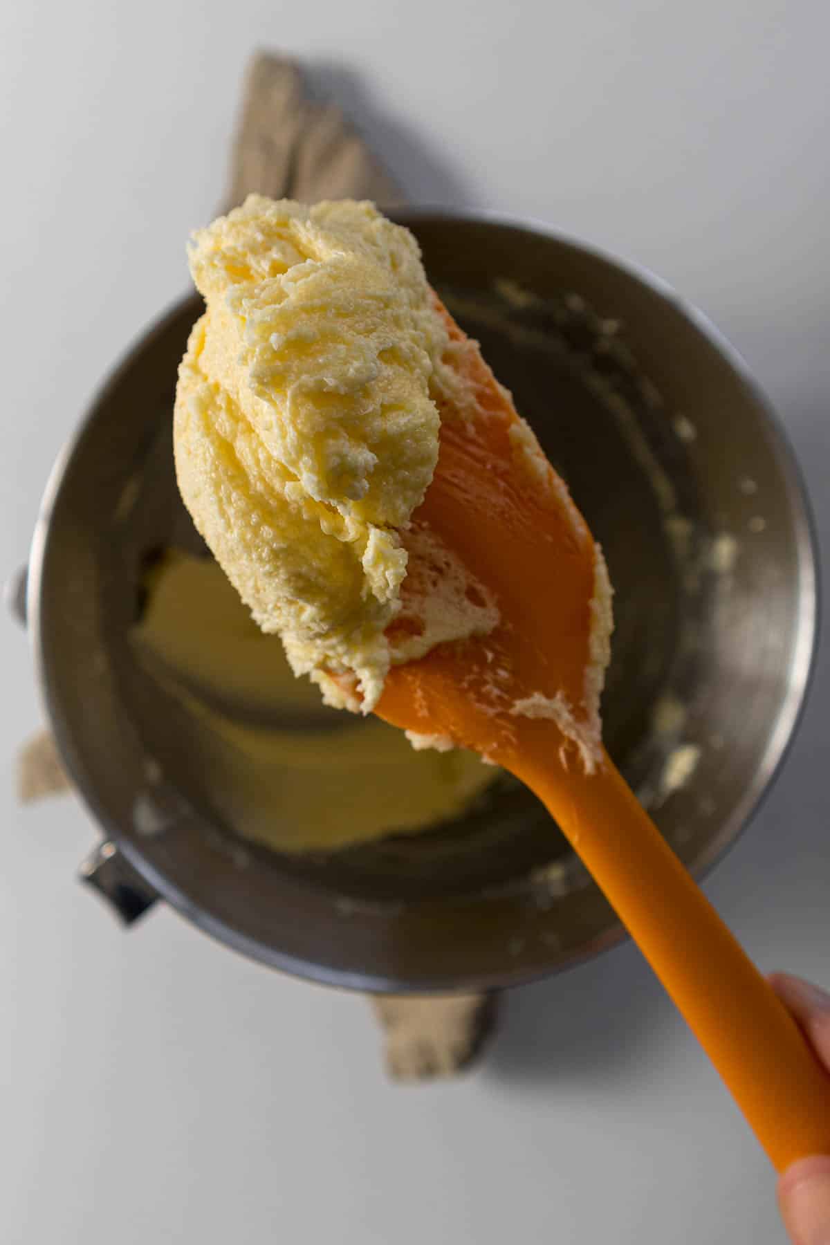 Creamed butter and sugar on a silicone spatula.