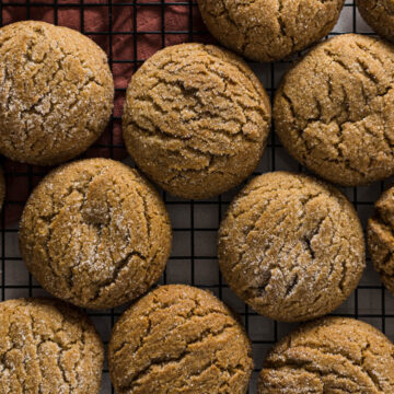 Ginger biscuits on a cooling rack.