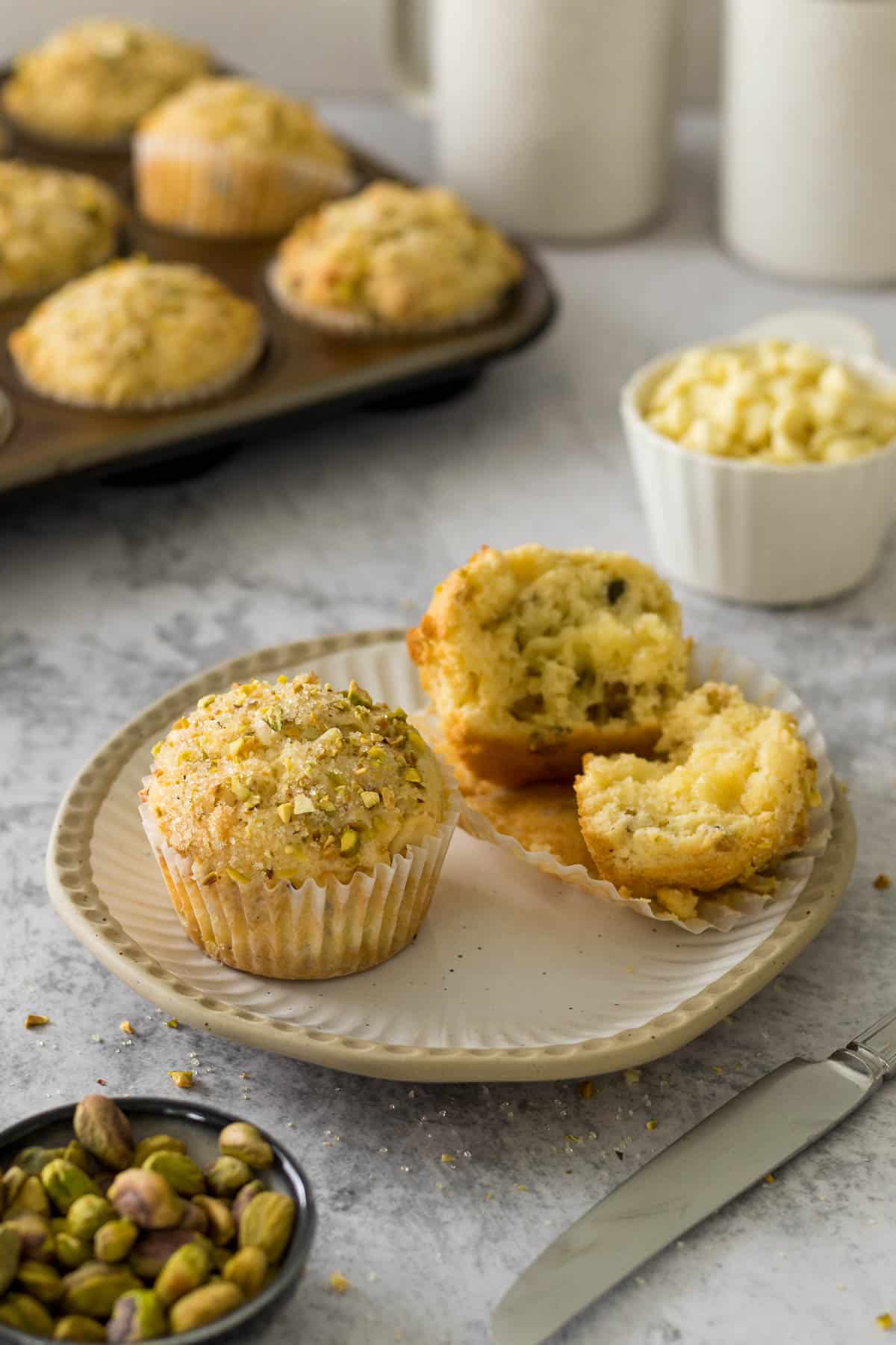 Pistachio muffins on a plate.