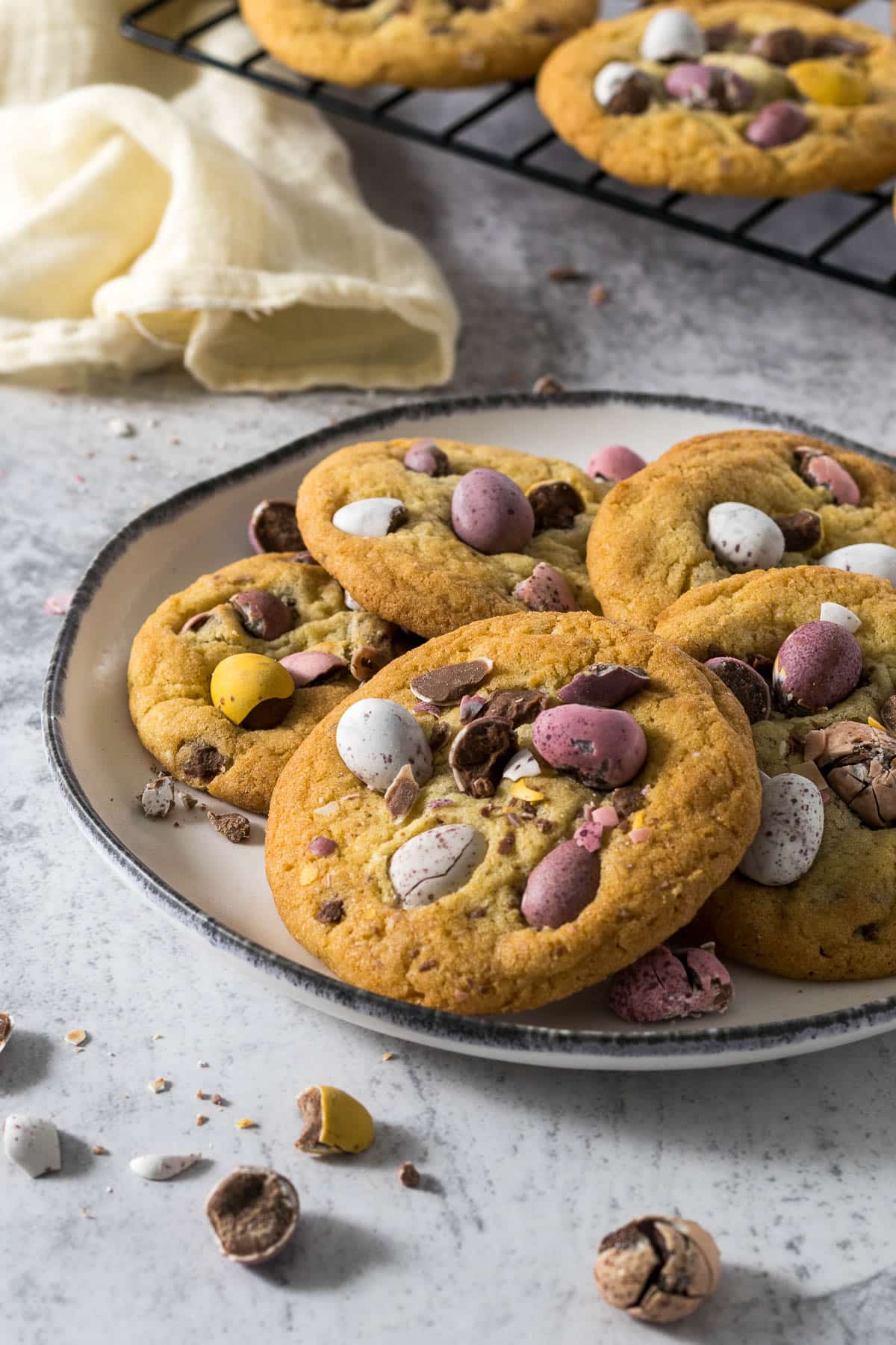 Mini eggs cookies arranged in a circle on a plate.