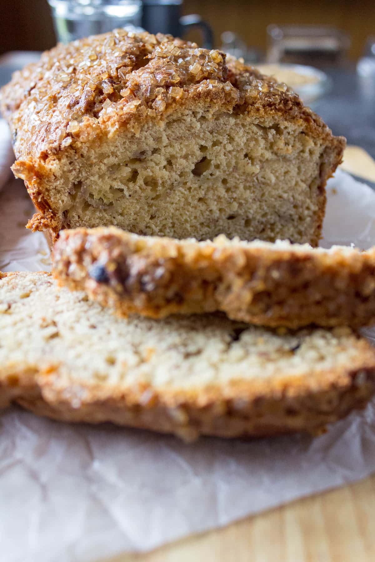 Sliced banana bread topped with coffee sugar.