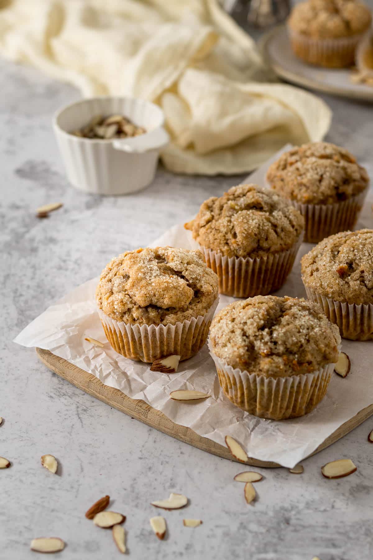 Banana carrot muffins on a serving board.