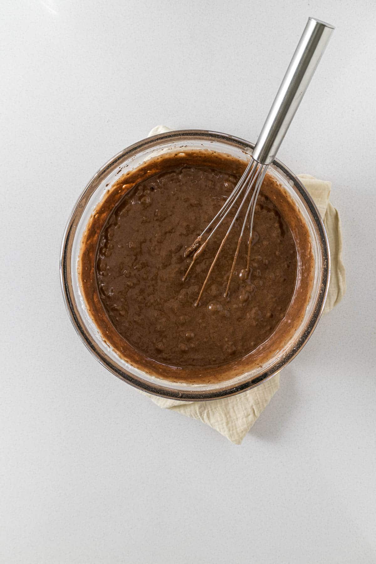 Chocolate cake batter in a large mixing bowl.