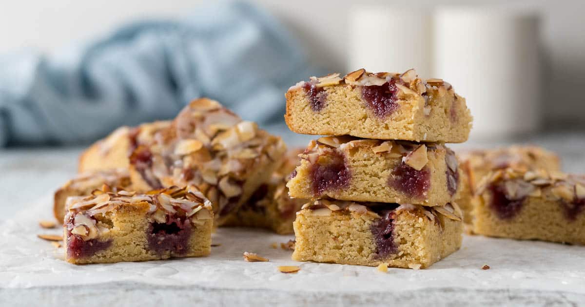 Bakewell blondies stacked on each other.