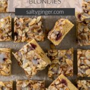 Pin - Sliced Bakewell Blondies on a baking paper.