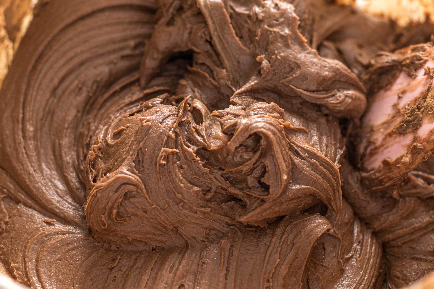 Chocolate cream cheese frosting in a bowl.