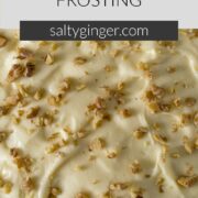 Pin - Cream cheese frosting sprinkled with walnut pieces.