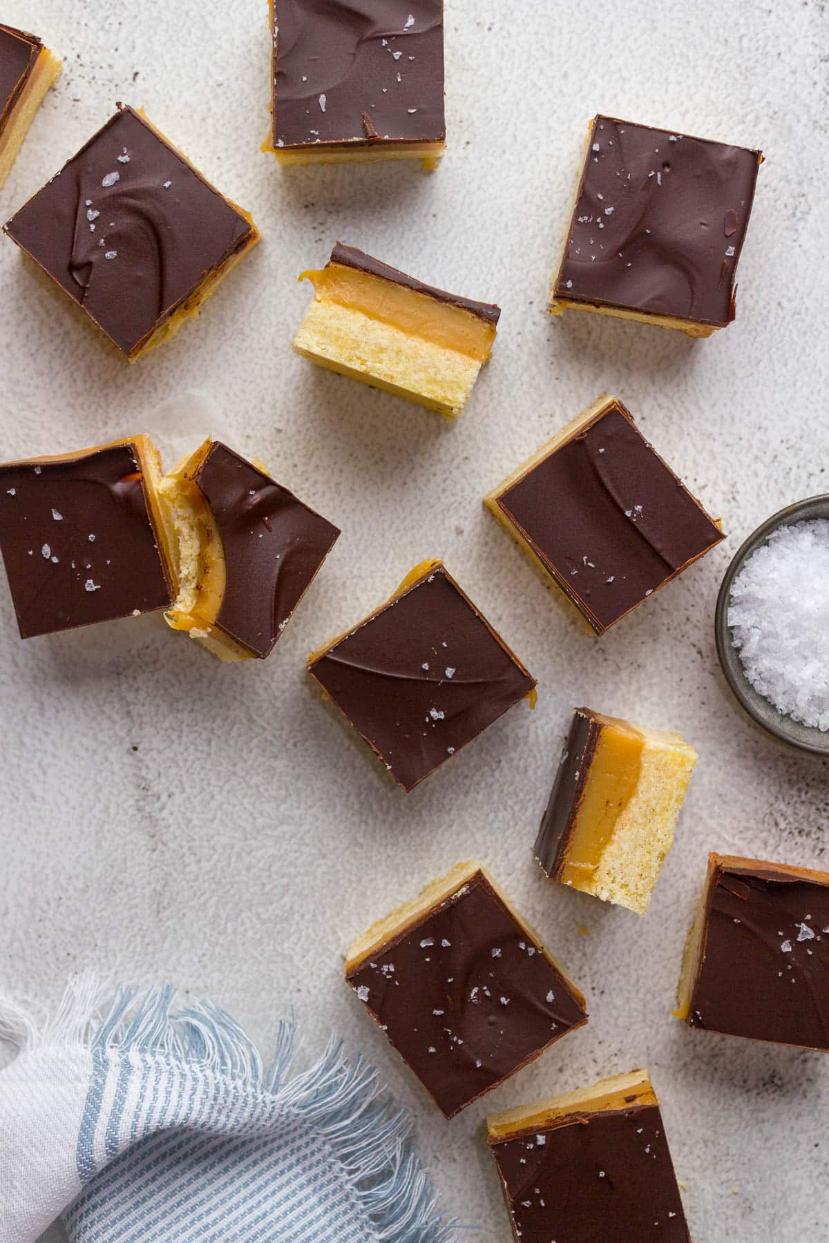 Caramel slices showing shortbread, caramel and chocolate layers.