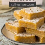 Pin - Lemon bars stacked on a plate.