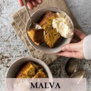 Pin - Bowl of Malva pudding with some whipped cream.