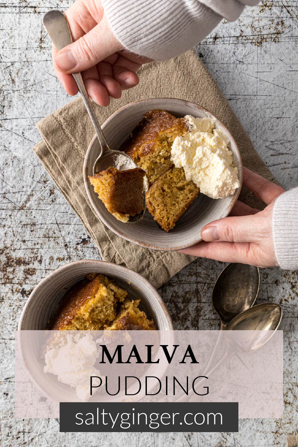 Pin - Bowl of Malva pudding with some whipped cream.