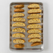 Step 9 - baked biscotti laid out on a baking tray for the second bake.