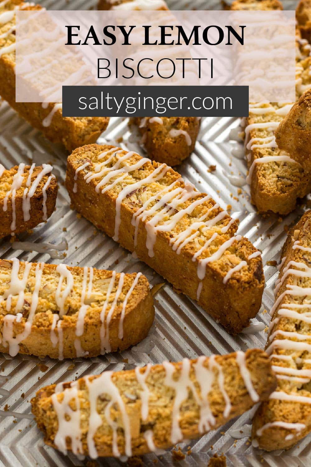 Pin - Easy Lemon Biscotti with a glaze on a baking tray.