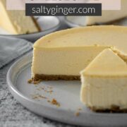 Pin - Sliced Philadelphia cheesecake on a serving plate.