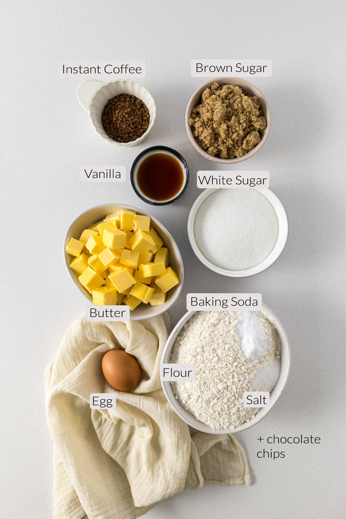 Coffee cookie ingredients - flour, salt, baking soda, egg, butter, brown sugar, white sugar, vanilla, and coffee.