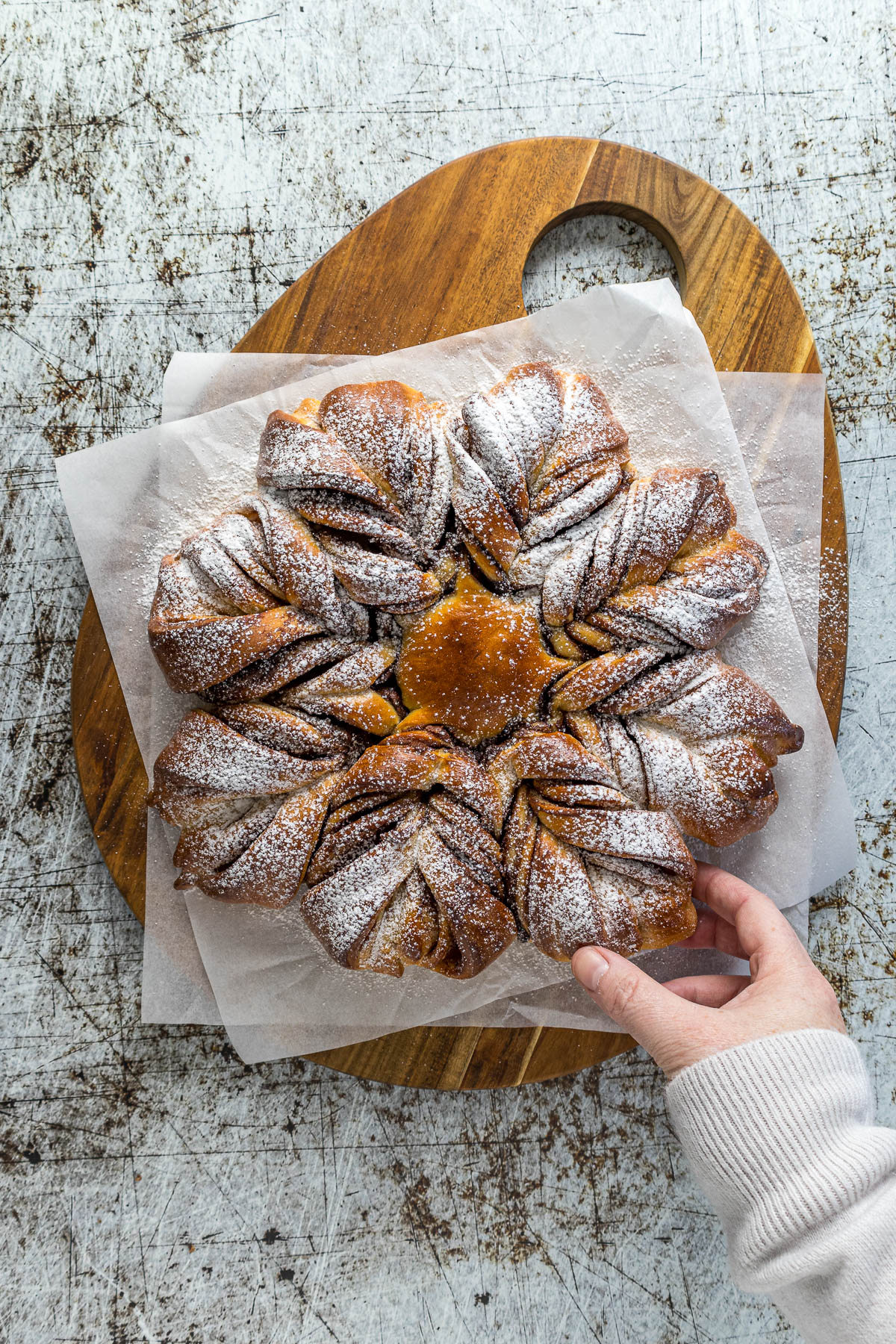 Nutella Star Bread dusted with powdered sugar on a serving platter.
