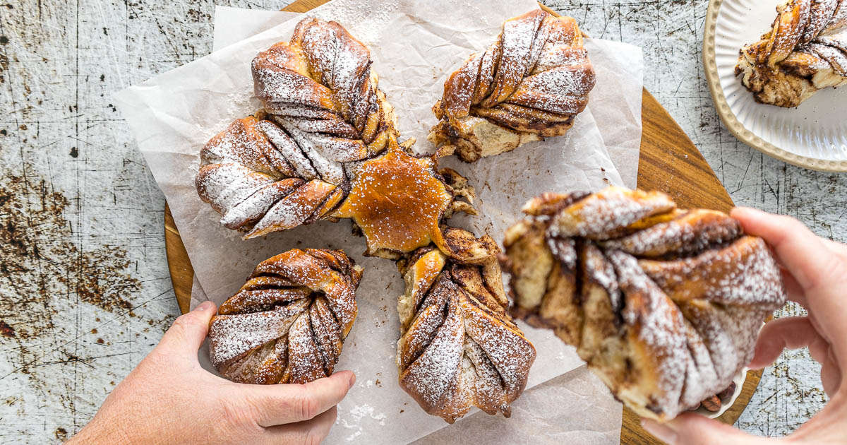 Nutella star bread being pulled apart by two hands.