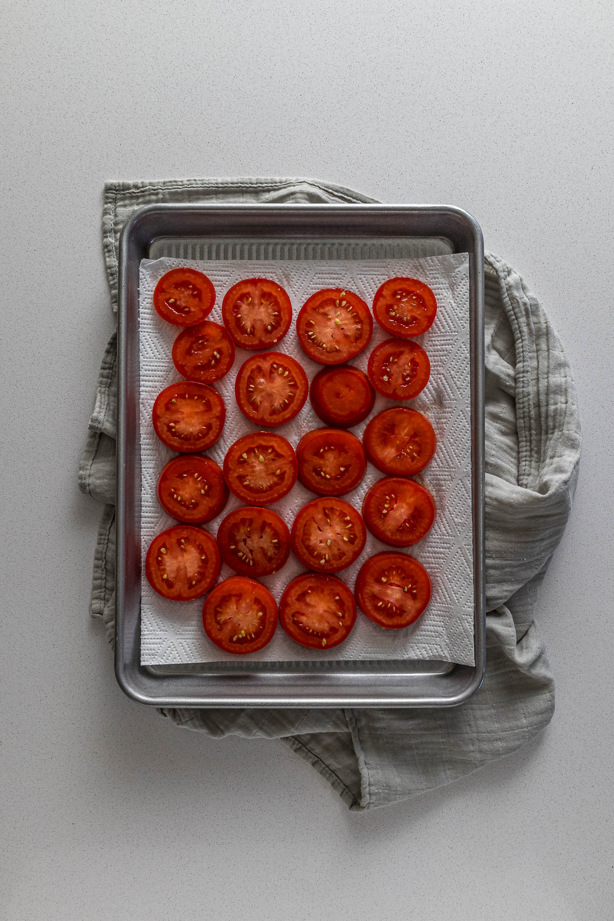 Step 5 - Removing excess moisture from tomatoes by placing them on paper towels.