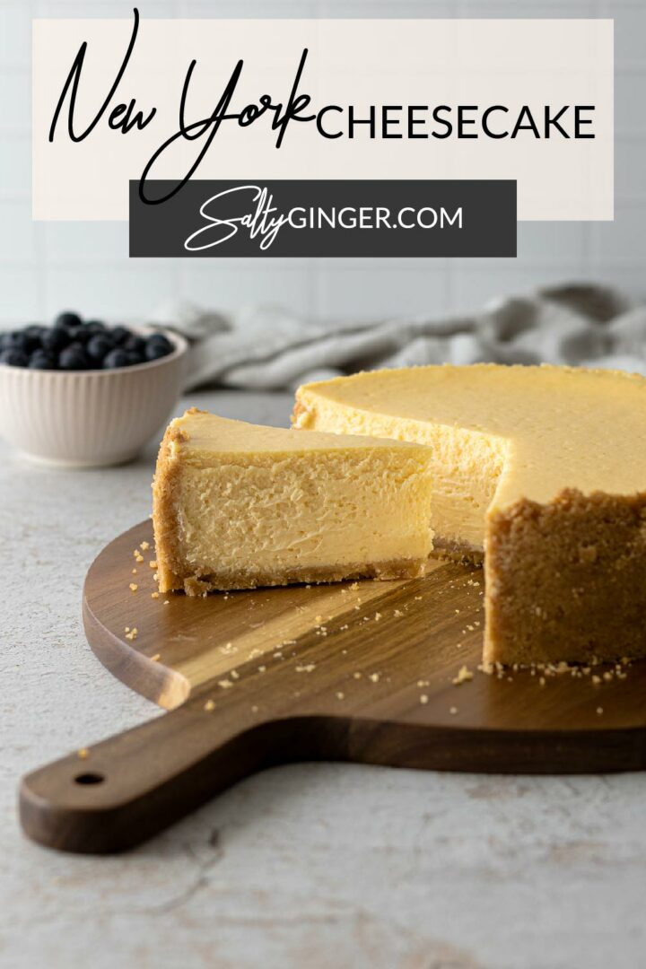 Pin - New York Cheesecake on a serving board.